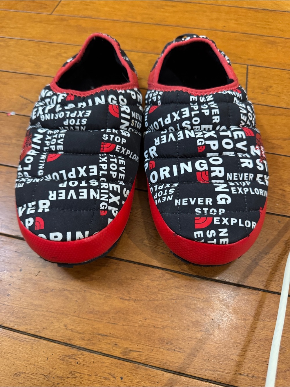 The North Face Men’s Quilted Slip-On Slippers in Black and Red